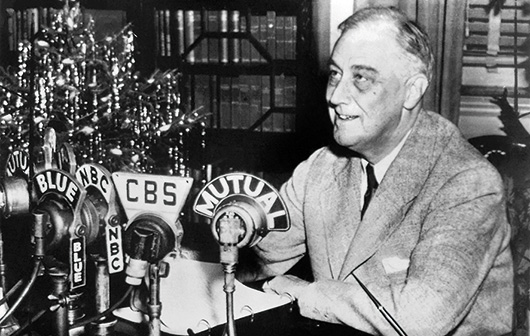 Franklin D. Roosevelt recording his fireside chat on Christmas Eve 1943